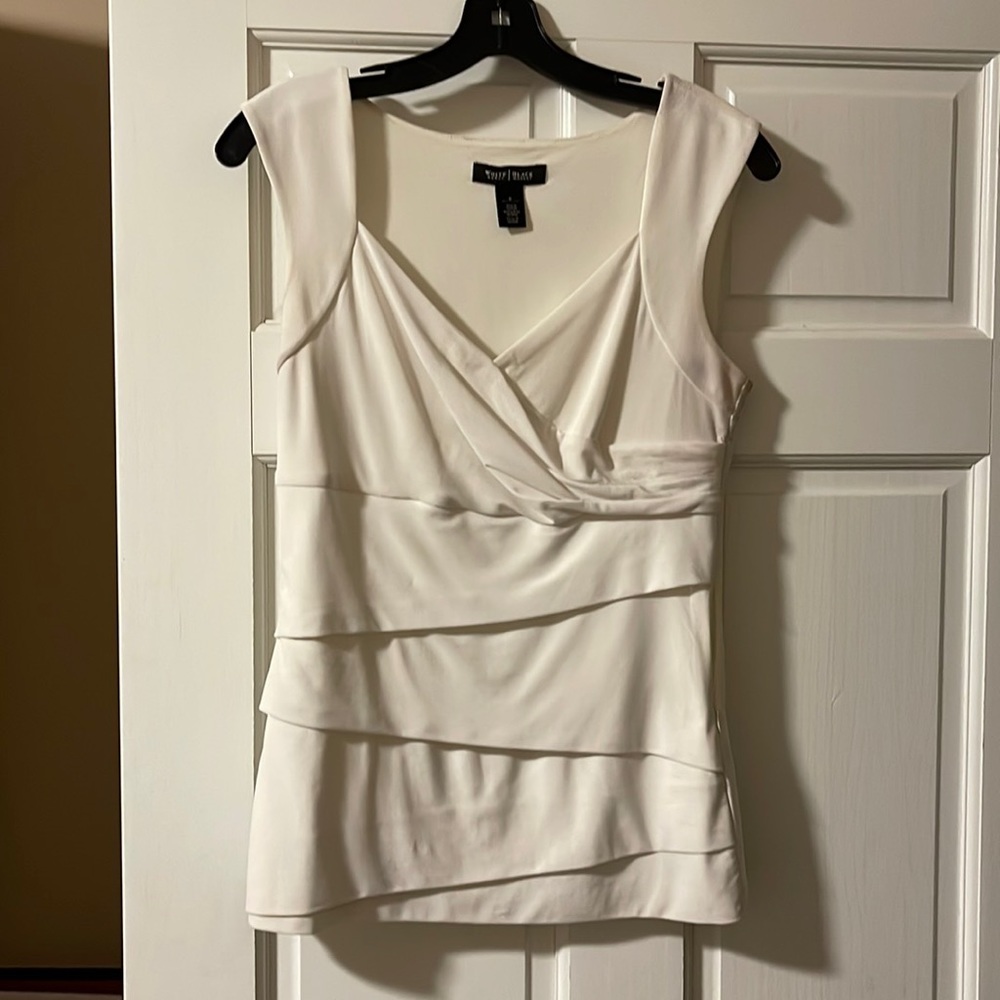 Very fitted sleeveless blouse